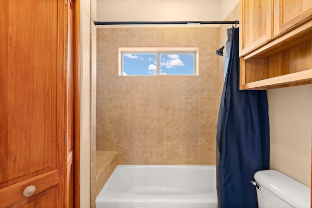 bathroom with toilet and shower / tub combo with curtain