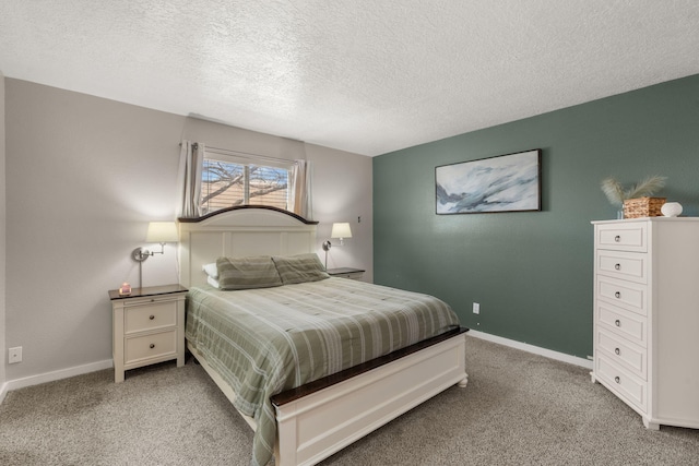 bedroom with light carpet, a textured ceiling, and baseboards