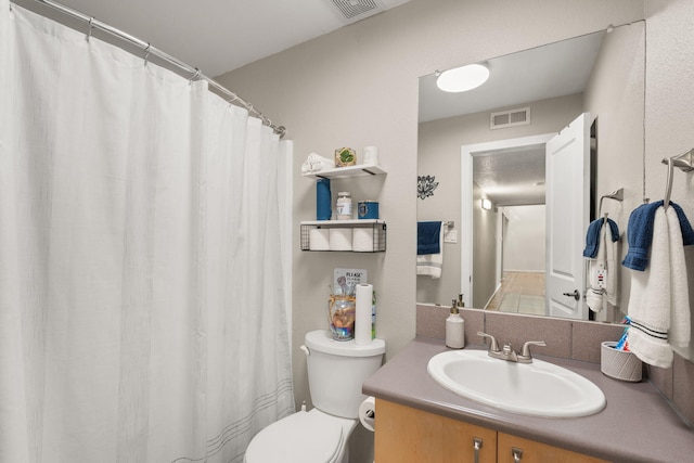 full bathroom with visible vents, toilet, and vanity