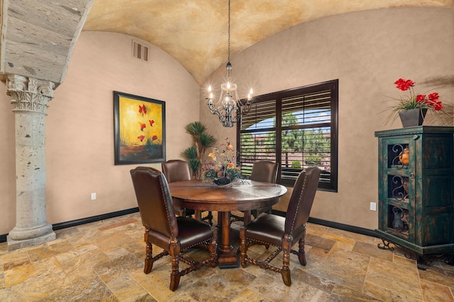 dining area featuring stone tile floors, decorative columns, visible vents, and baseboards