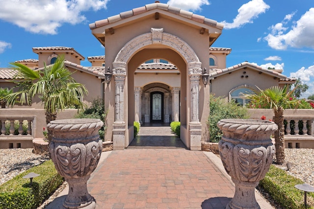 doorway to property with stucco siding