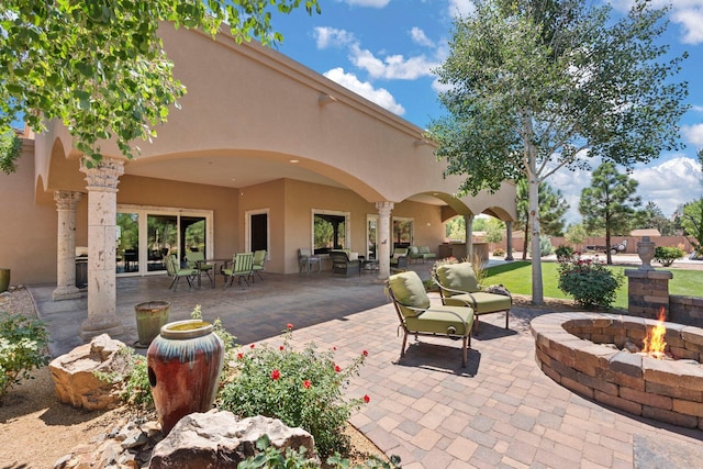 view of patio with a fire pit