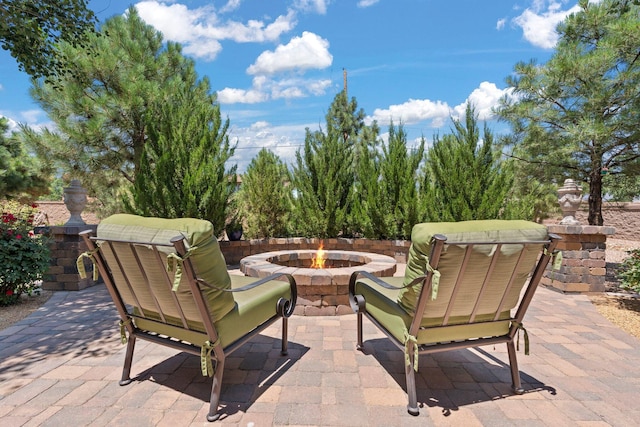 view of patio with a fire pit