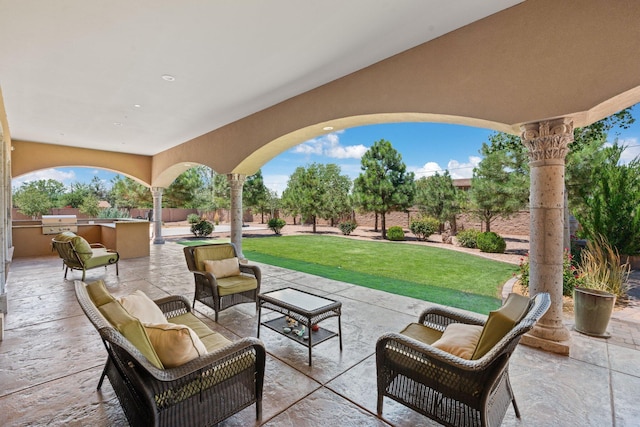 view of patio featuring area for grilling, an outdoor living space, a grill, and a fenced backyard