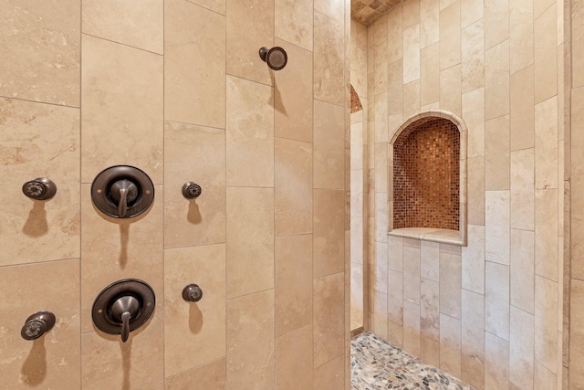 bathroom with tiled shower