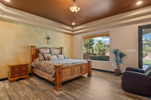 bedroom featuring recessed lighting, visible vents, dark wood-style flooring, and baseboards