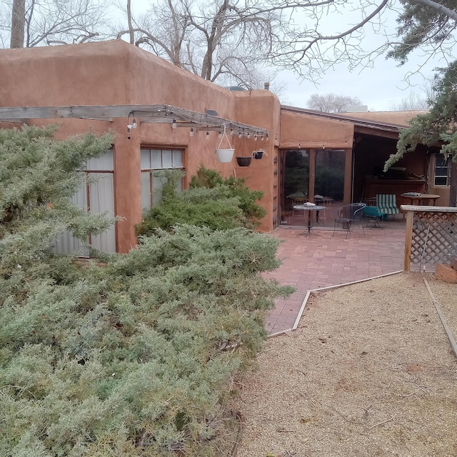 rear view of property with a patio