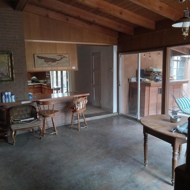 interior space featuring wooden ceiling and vaulted ceiling with beams