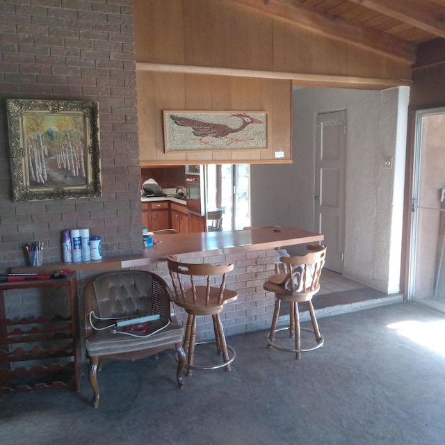 dining space featuring wooden ceiling and lofted ceiling with beams