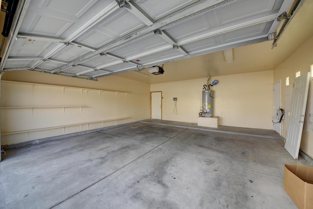 garage featuring a garage door opener and water heater