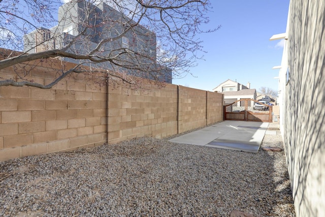 view of yard featuring a fenced backyard and a patio