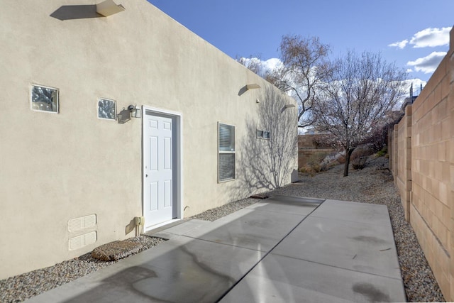 view of patio / terrace with visible vents and fence