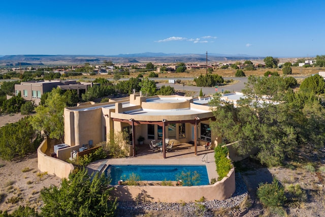 exterior space featuring a patio and a mountain view