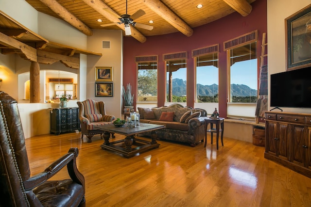 living room with ceiling fan, wood ceiling, beam ceiling, recessed lighting, and wood finished floors