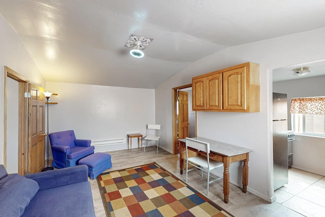 living room featuring lofted ceiling and baseboards