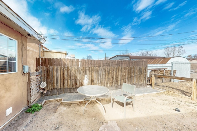 view of patio / terrace featuring fence