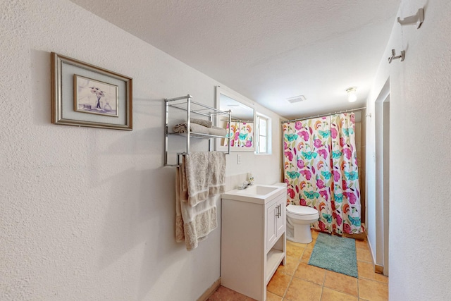 full bath with a shower with curtain, toilet, a textured ceiling, tile patterned flooring, and vanity