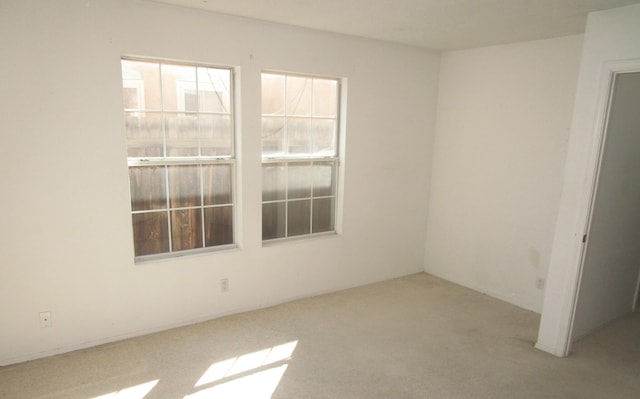 empty room with carpet flooring