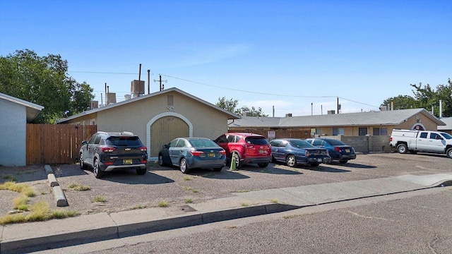 uncovered parking lot with fence