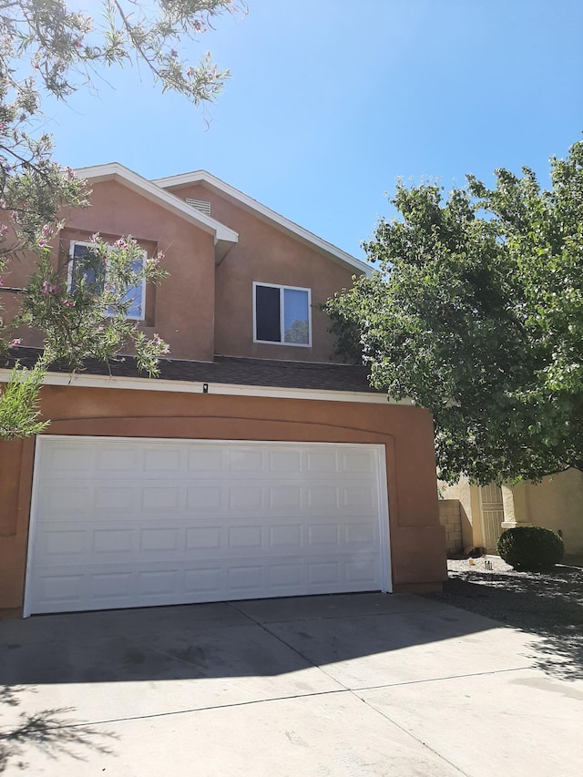 garage featuring driveway