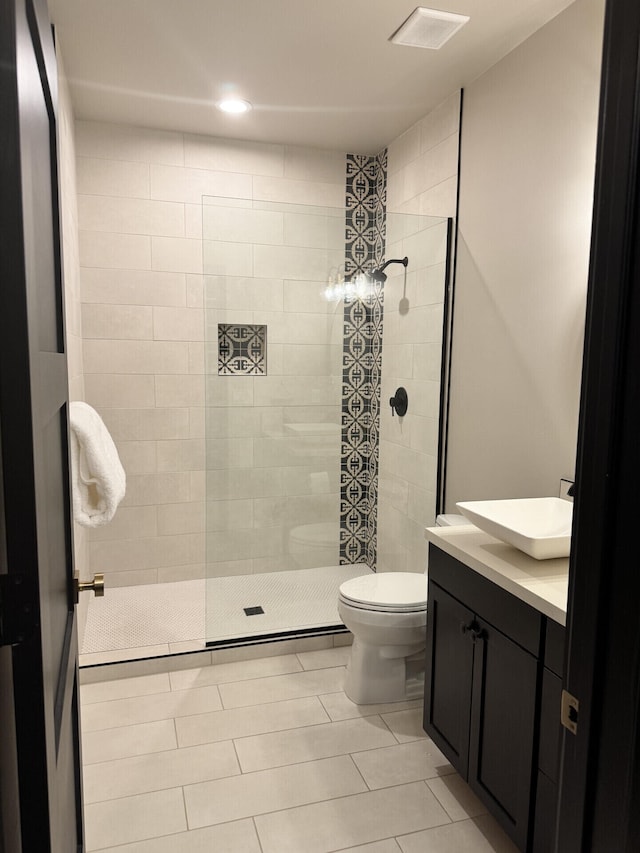 full bath featuring visible vents, toilet, walk in shower, and vanity