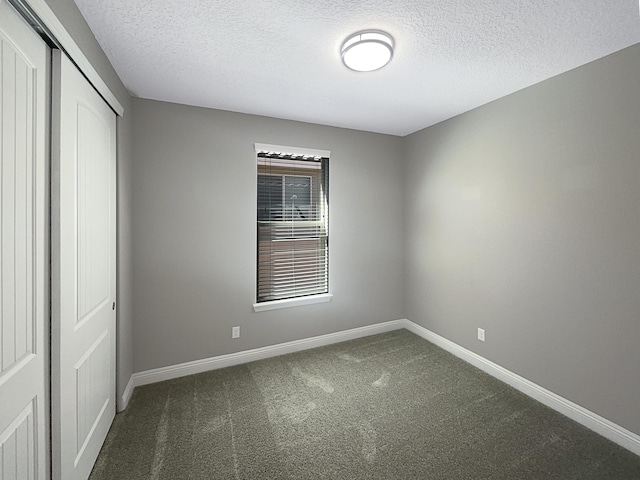 unfurnished bedroom featuring carpet, a closet, and baseboards