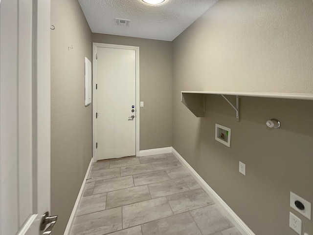 washroom featuring visible vents, washer hookup, laundry area, hookup for an electric dryer, and a textured ceiling