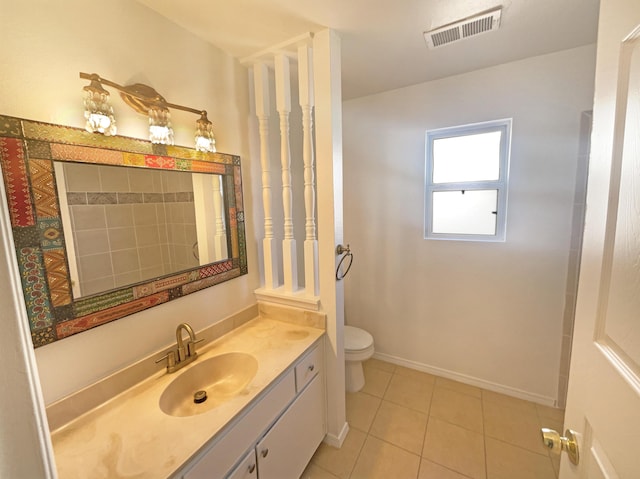 full bath with vanity, baseboards, visible vents, tile patterned flooring, and toilet