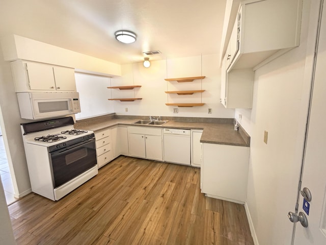 kitchen featuring a sink, light wood-style floors, white cabinets, white appliances, and open shelves