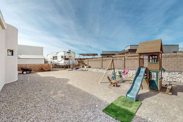 communal playground with a fenced backyard