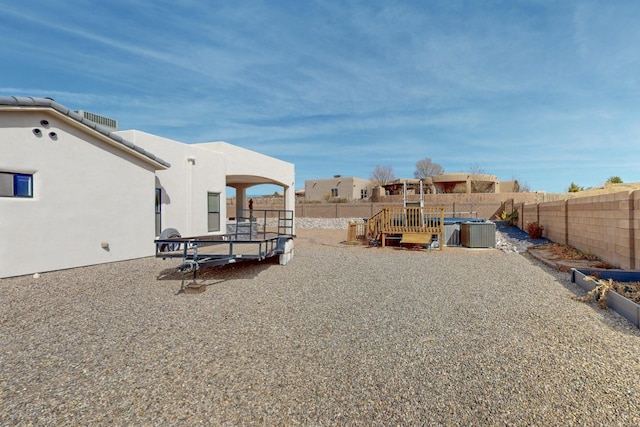 view of yard with a fenced backyard and a playground