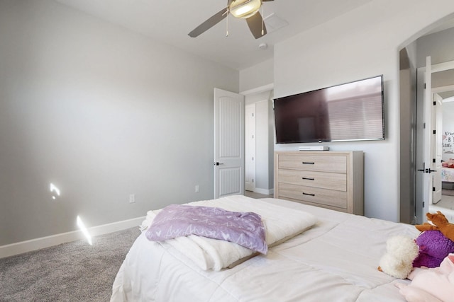 bedroom featuring baseboards, ceiling fan, and carpet flooring