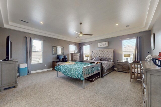 5721 Rio Animas Rd NE, Rio Rancho, NM 87144 - bedroom featuring a raised ceiling, light colored carpet, and ceiling fan