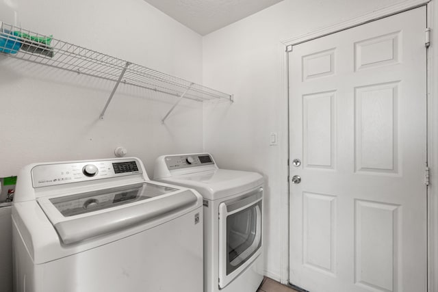 washroom with laundry area and washing machine and clothes dryer