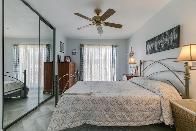 bedroom with a closet and a ceiling fan