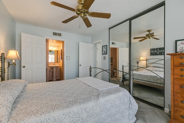 bedroom featuring visible vents and a ceiling fan