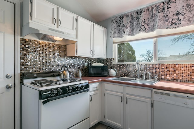 kitchen with white appliances, a sink, under cabinet range hood, white cabinetry, and backsplash