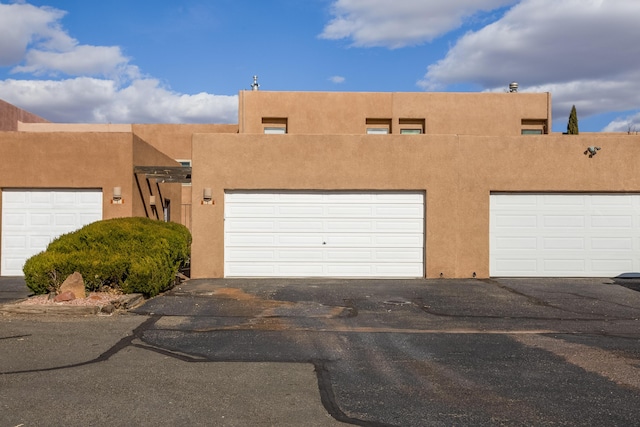 adobe home featuring stucco siding