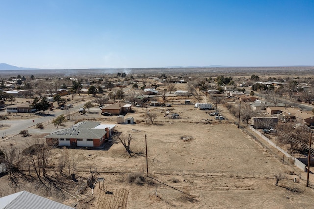 aerial view featuring a mountain view and view of desert