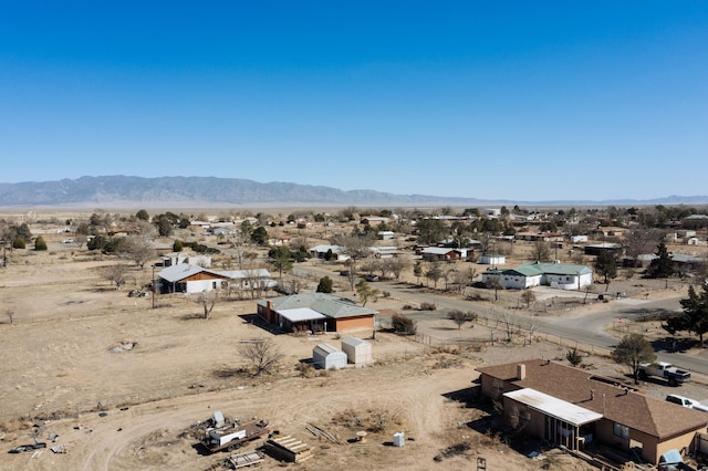 aerial view featuring a mountain view and a desert view