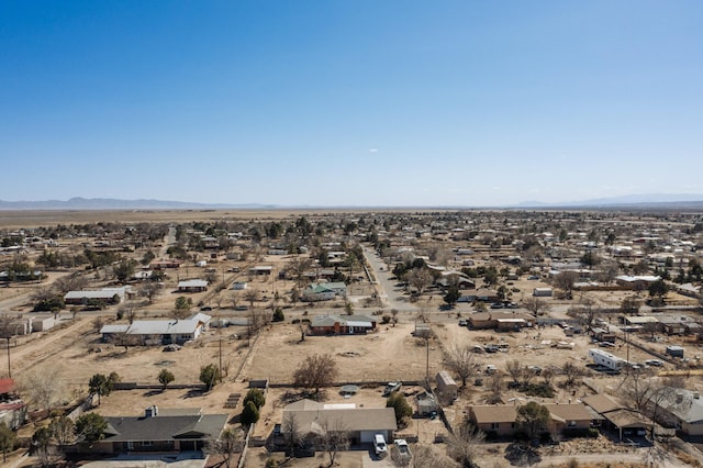 bird's eye view featuring a mountain view and a desert view