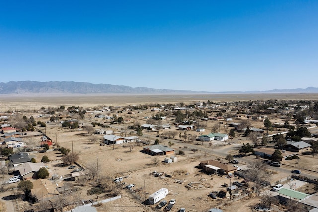 aerial view featuring a mountain view and view of desert