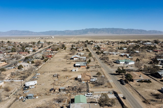 aerial view featuring view of desert and a mountain view