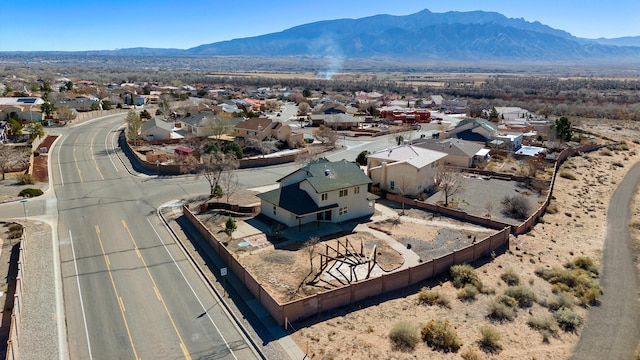 birds eye view of property with a mountain view and a residential view