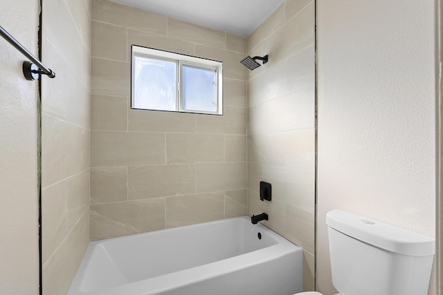 bathroom featuring toilet and bathing tub / shower combination