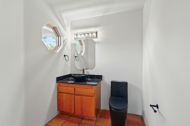 bathroom with tile patterned flooring and vanity