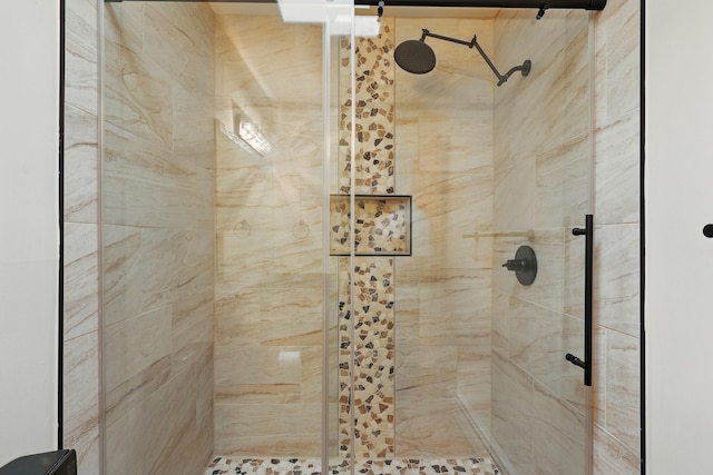 bathroom with a shower stall