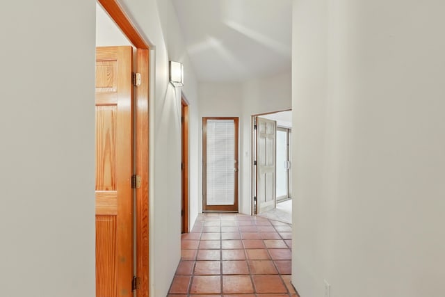 hallway with light tile patterned floors