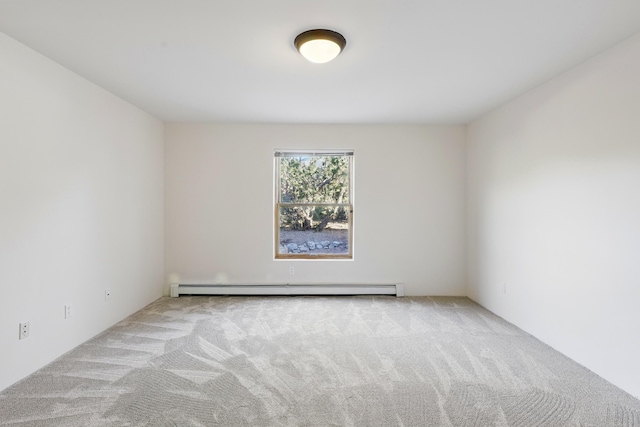 carpeted spare room with baseboard heating