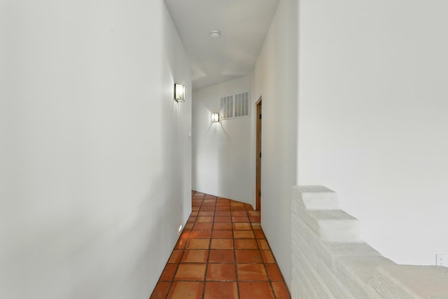 hall featuring tile patterned floors, stairway, and visible vents